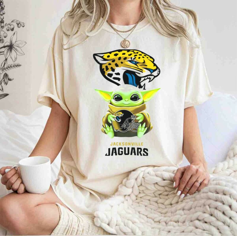 star wars baby yoda holding jacksonville jaguars helmet t shirt t shirt 1 1