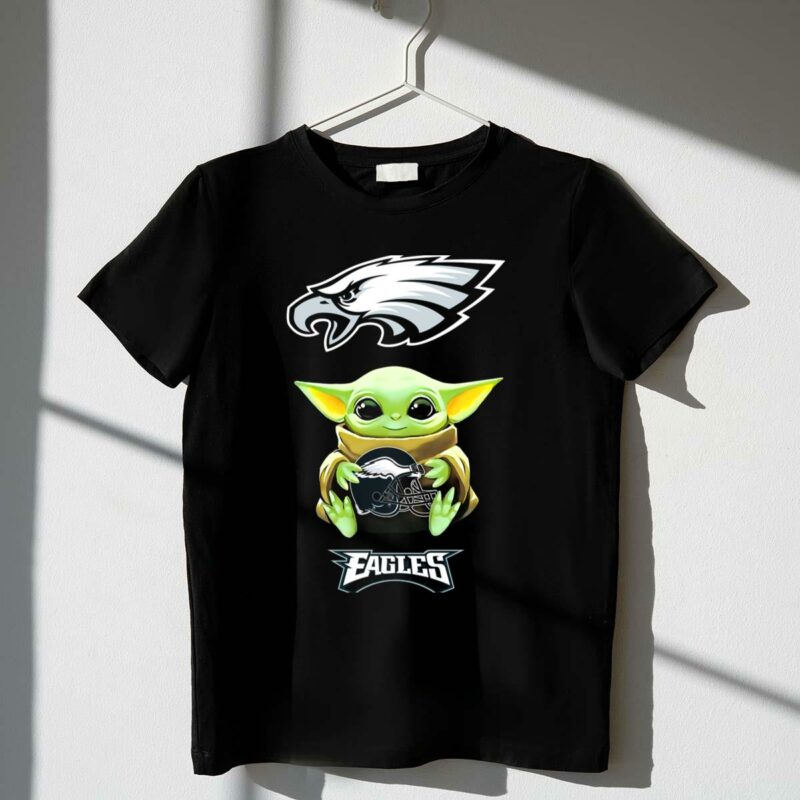 star wars baby yoda holding philadelphia eagles football helmet t shirt t shirt 1 1